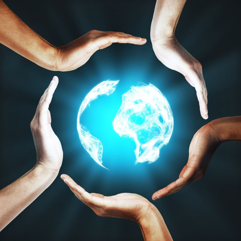 International global business concept. Human hands of different races around illuminated digital globe